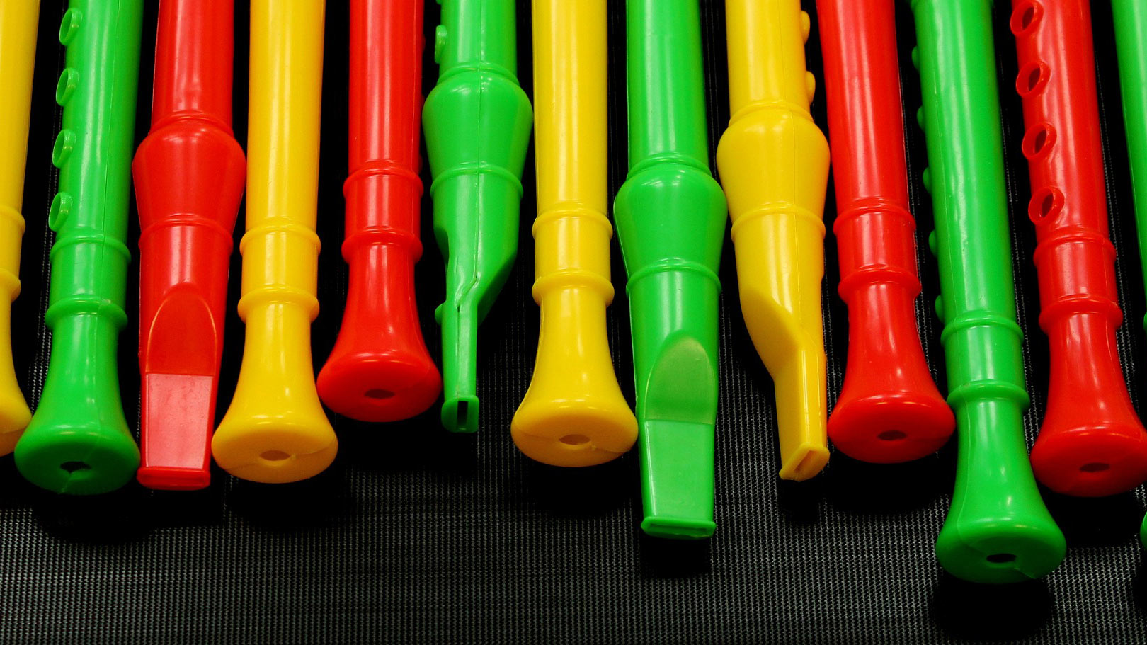 Row of children's recorders in bright colours