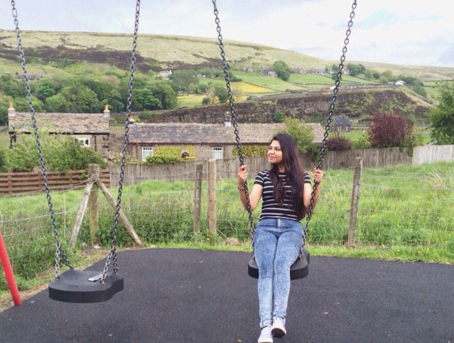 Picture of Fahmida on a swing
