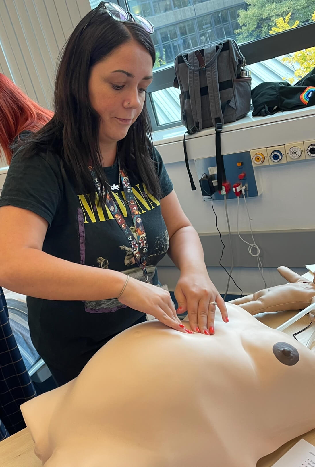 Student midwife Jaime working on a bump mannequin