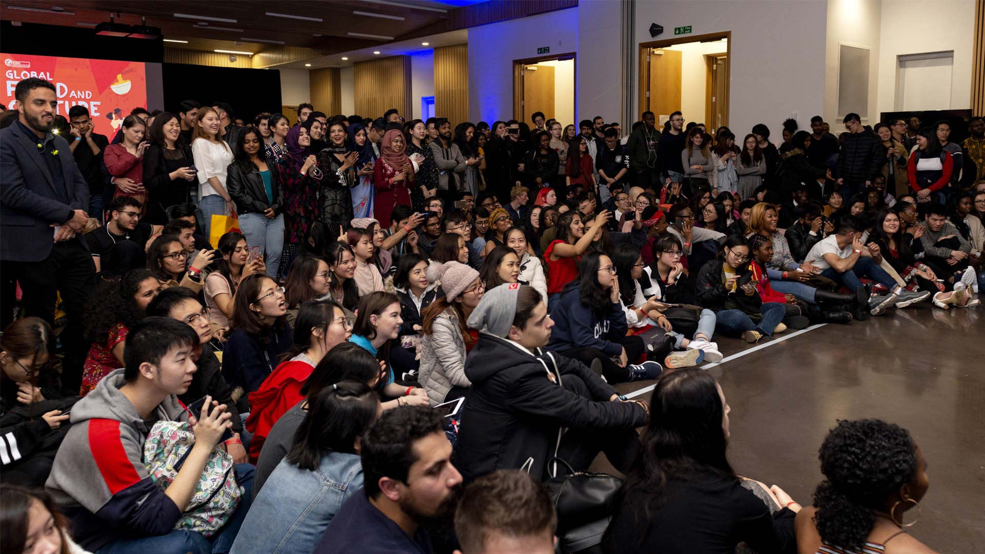 An audience watching a show on stage