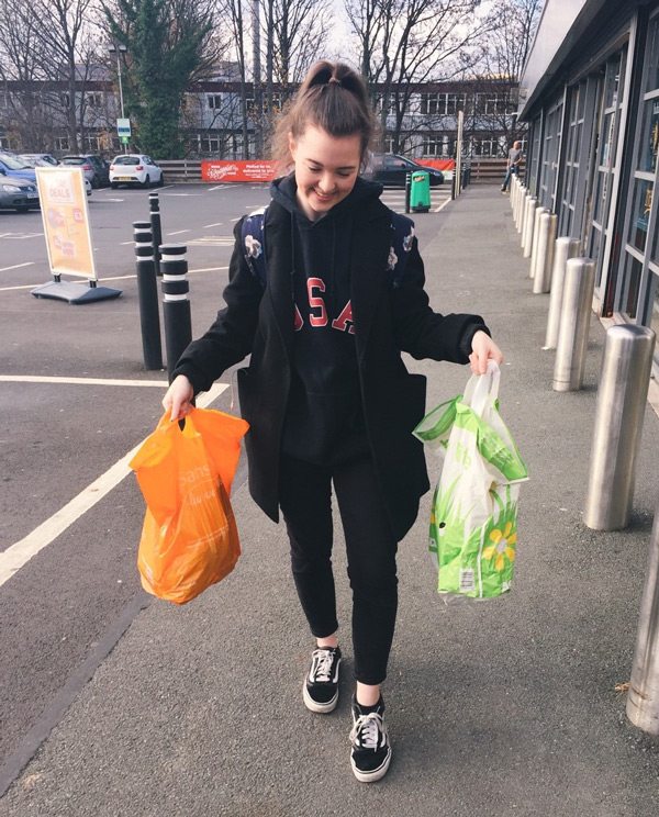 Rachel Heap carrying two bags of shopping.