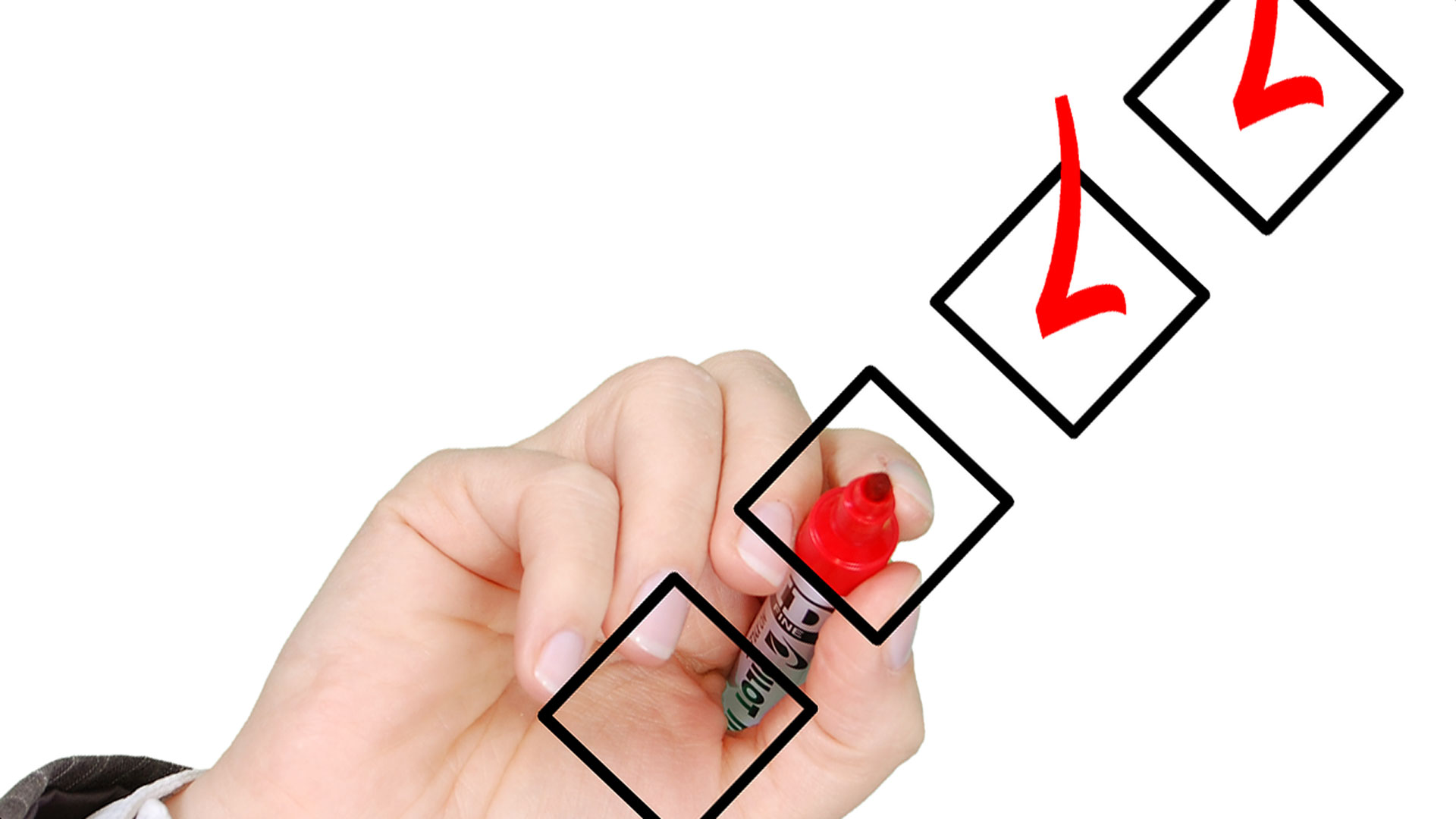 Hand drawing check marks on checklist