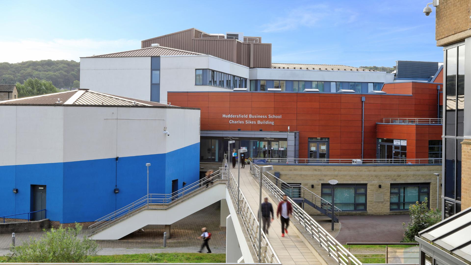 Students walking out of Huddersfield Business School Charles Sikes