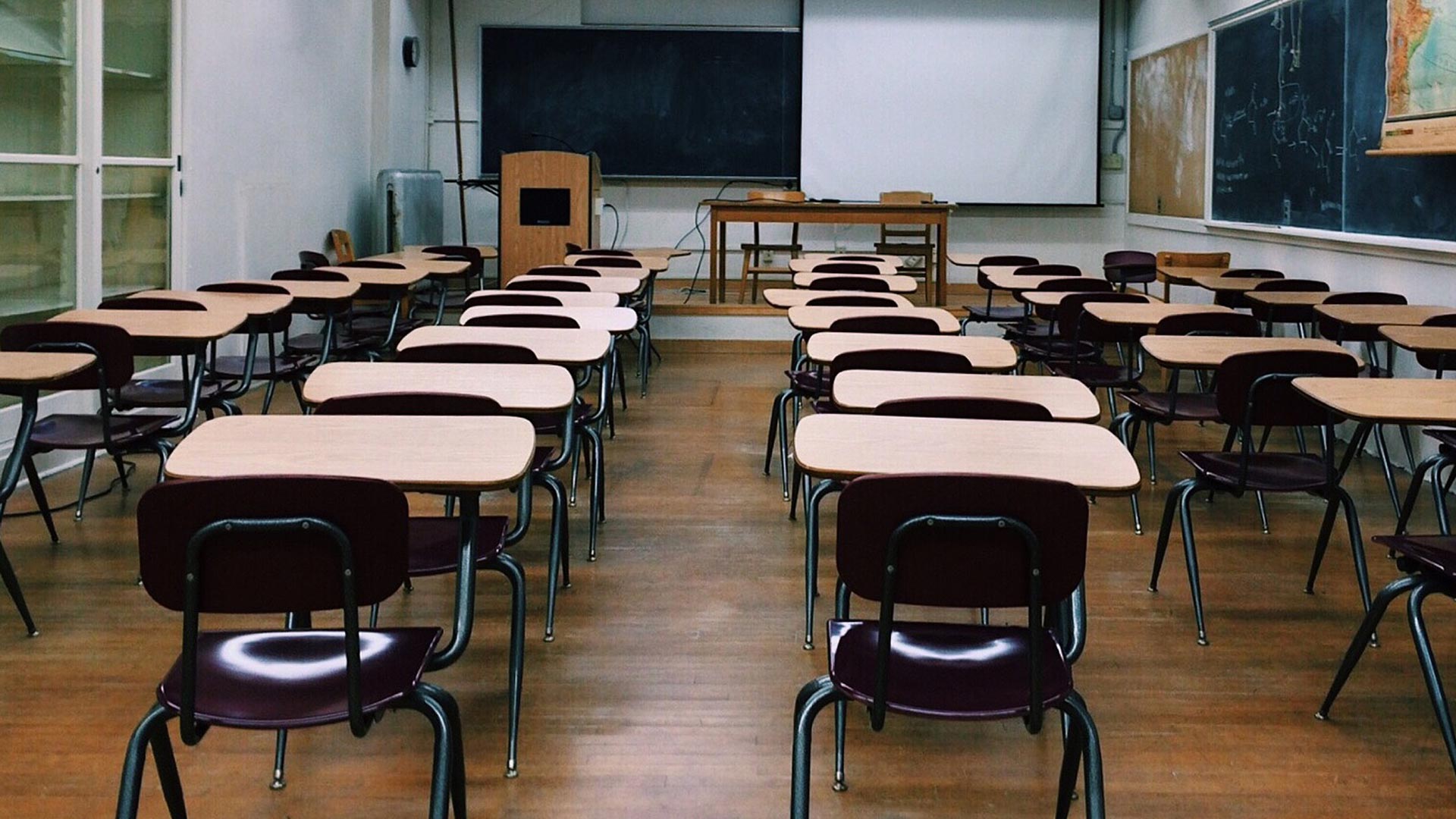 Classroom with board and desks, little else