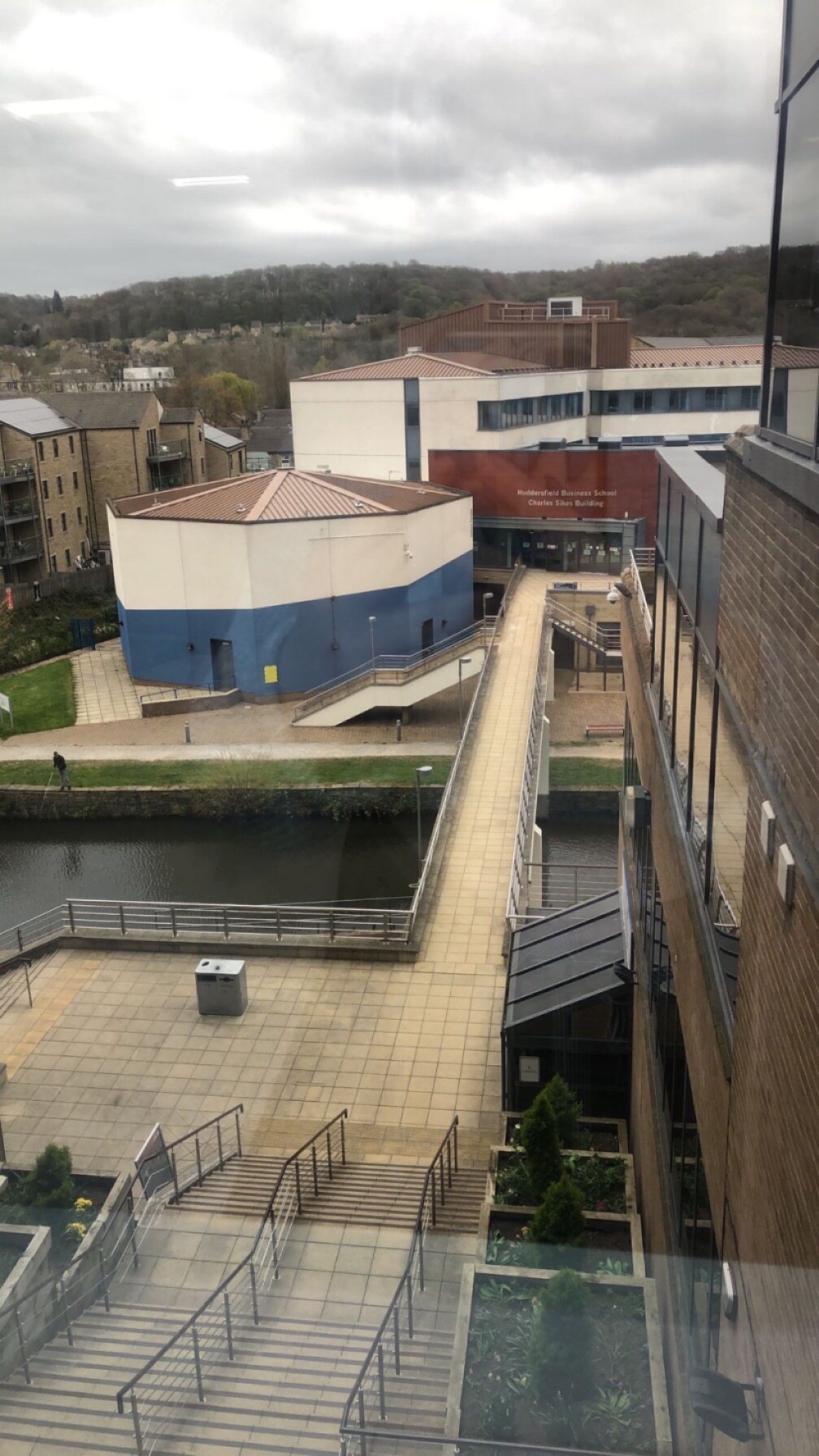 A view from Schwann Building over the canal bridge towards the Huddersfield Business School Charles Sikes Building