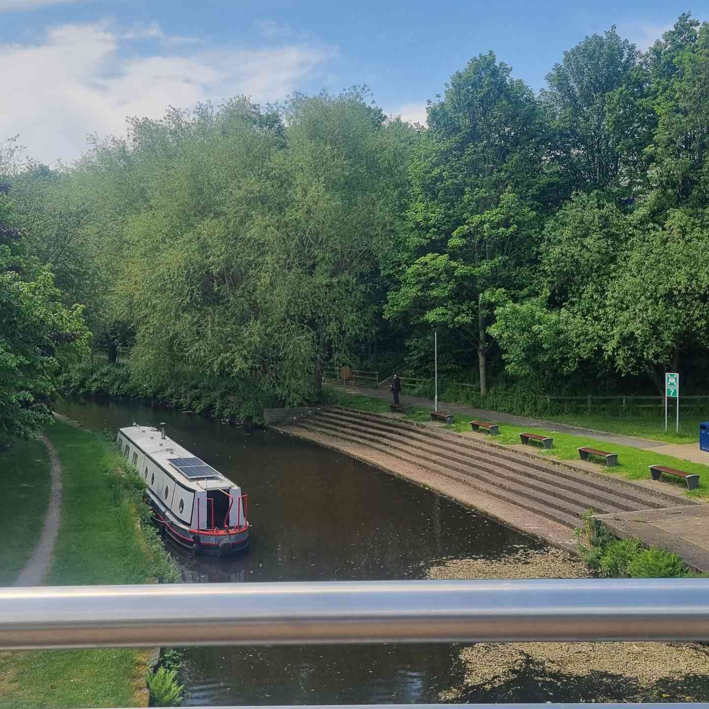 A view from campus bridge at University of Huddersfield looking towards a wooded area