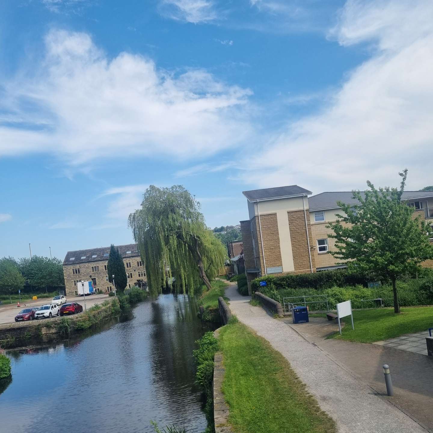 A view from Sikes to Schwann building bridge, looking towards Huddersfield Wide Canal.