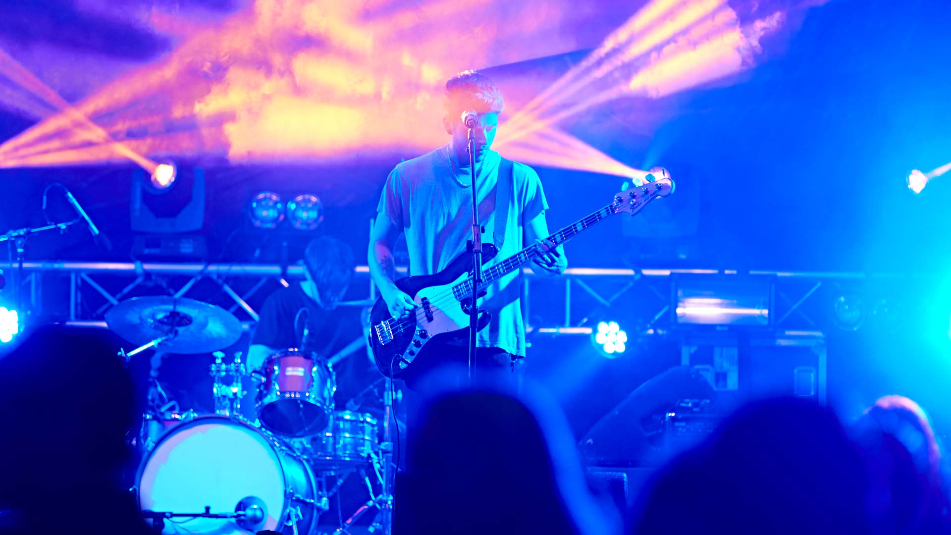 A man playing a guitar at a concert