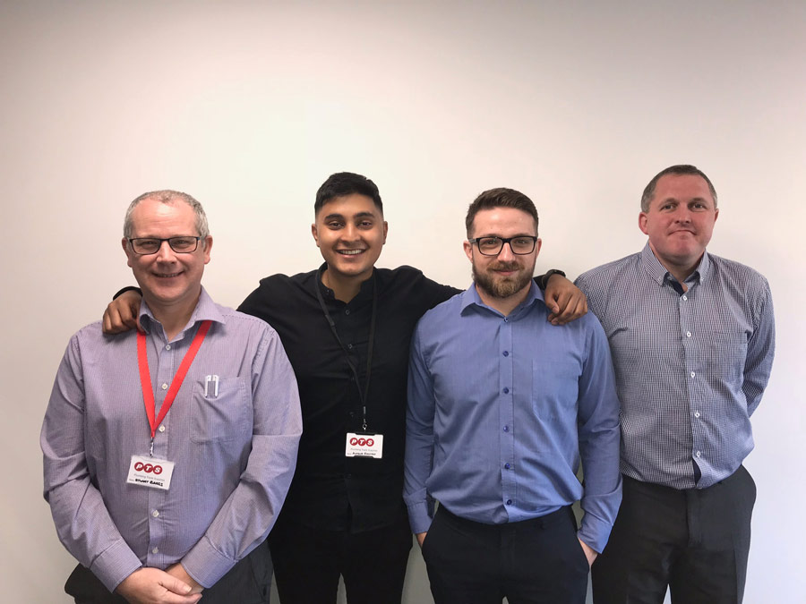 A photograph of Anasur Rahman with three other colleagues.