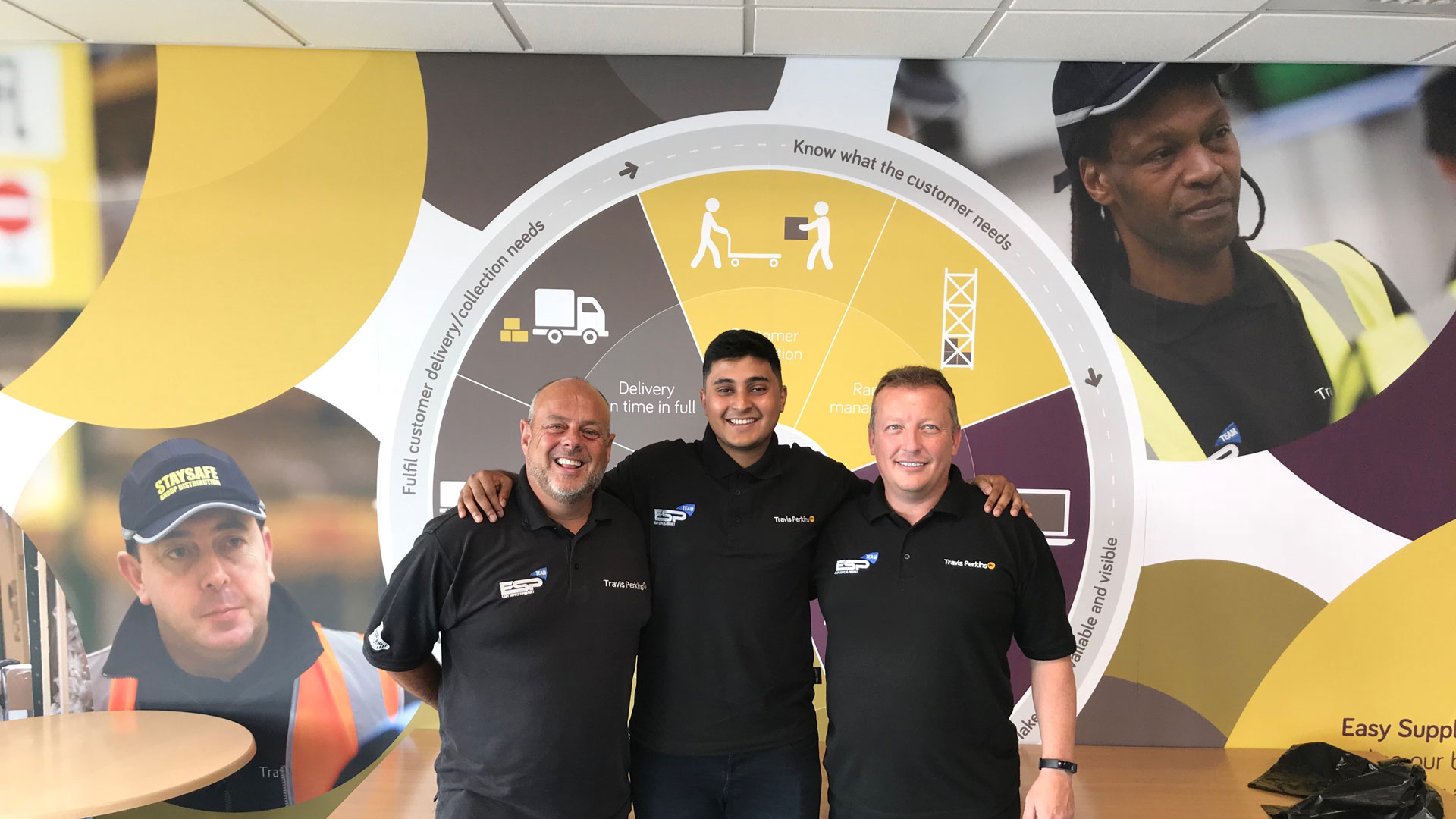 a photo of Anasur Rahman posing with some work colleagues.