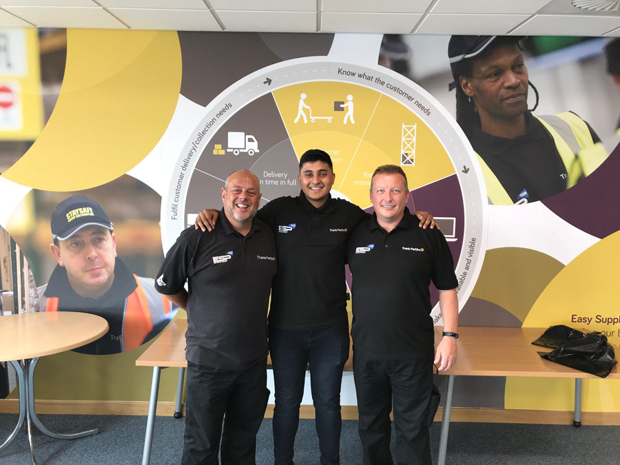 a photo of Anasur Rahman posing with some work colleagues.