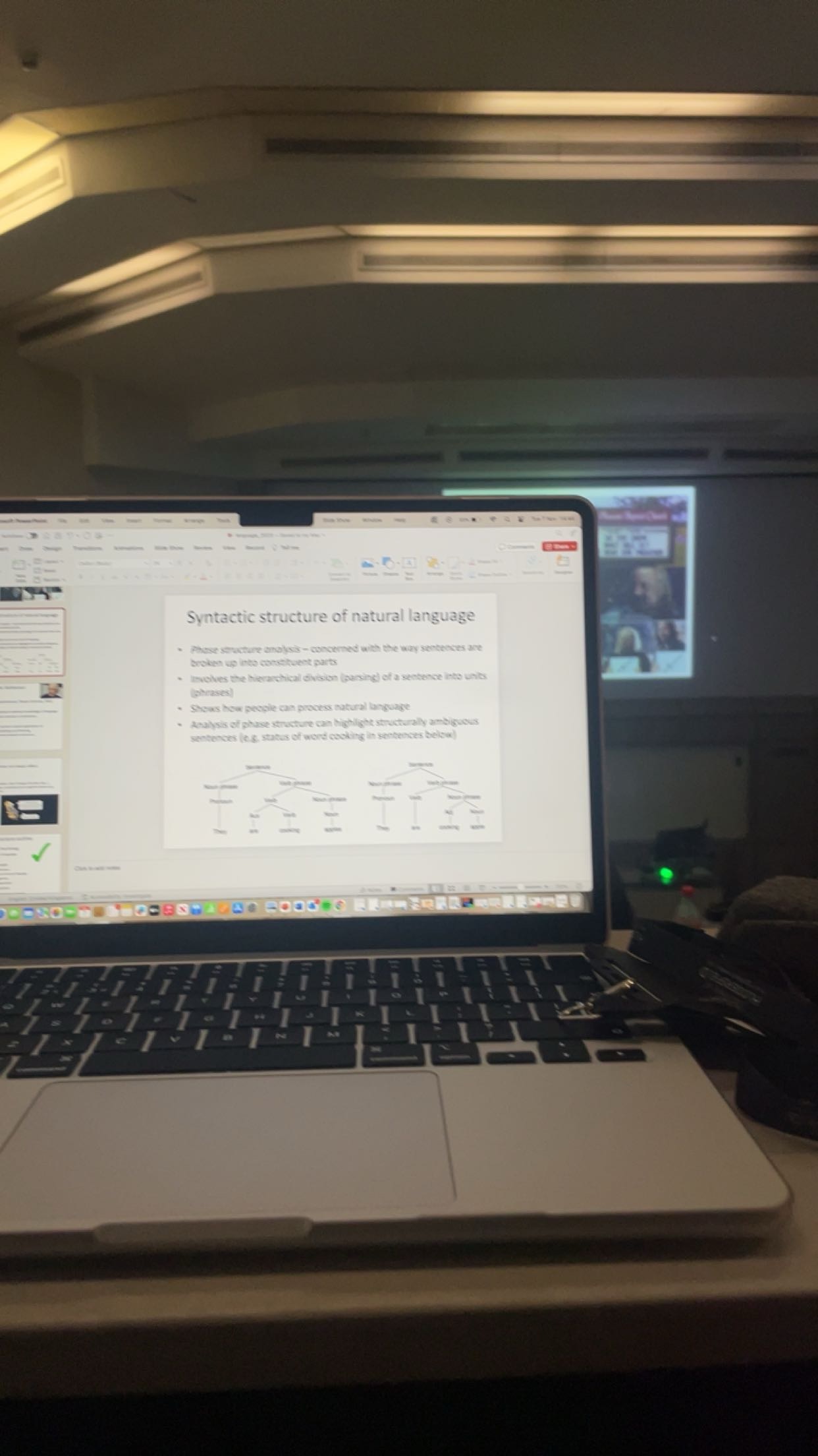 A laptop open with a graph on the screen