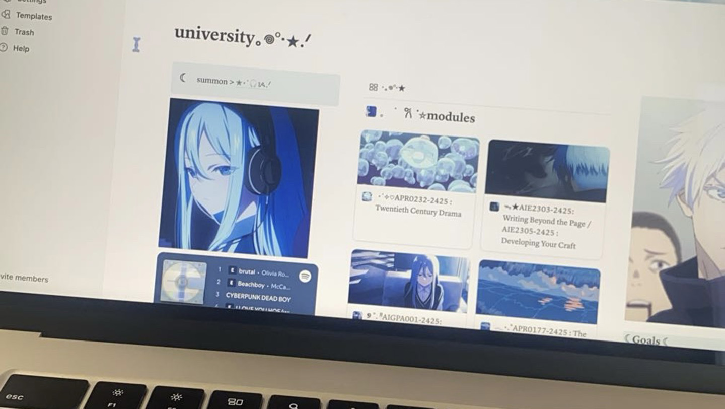 A laptop screen displaying the University's online learning platform with various course modules shown, including