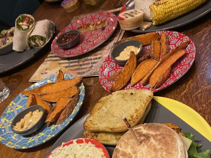 Brightly coloured plates with different foods