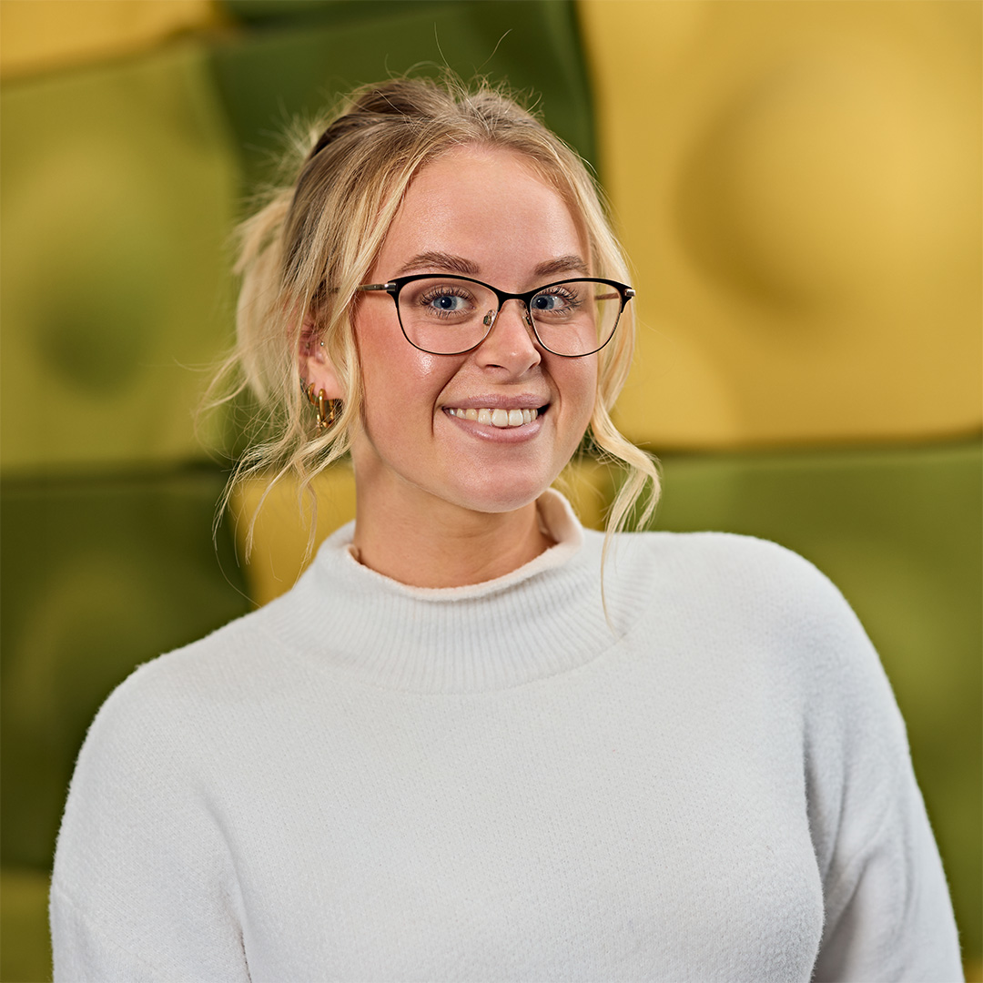 Liv Thompson smiles back at camera.