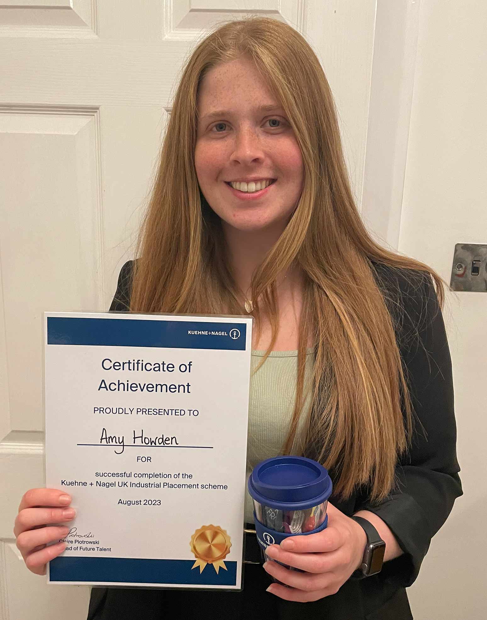 Amy Howden holding a certificate