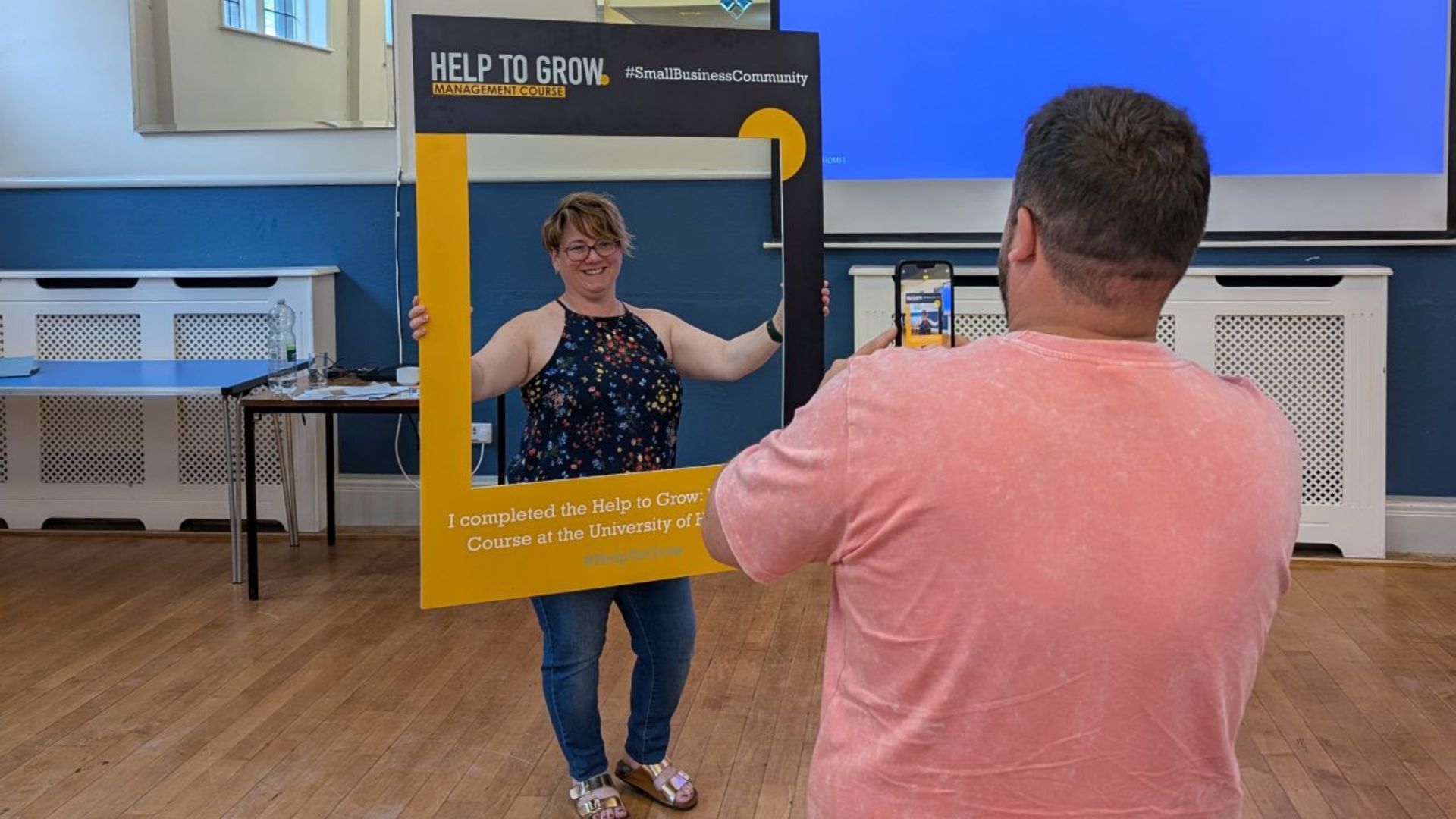 Claire Parker at the final Help to Grow session holding a completed the programme sign