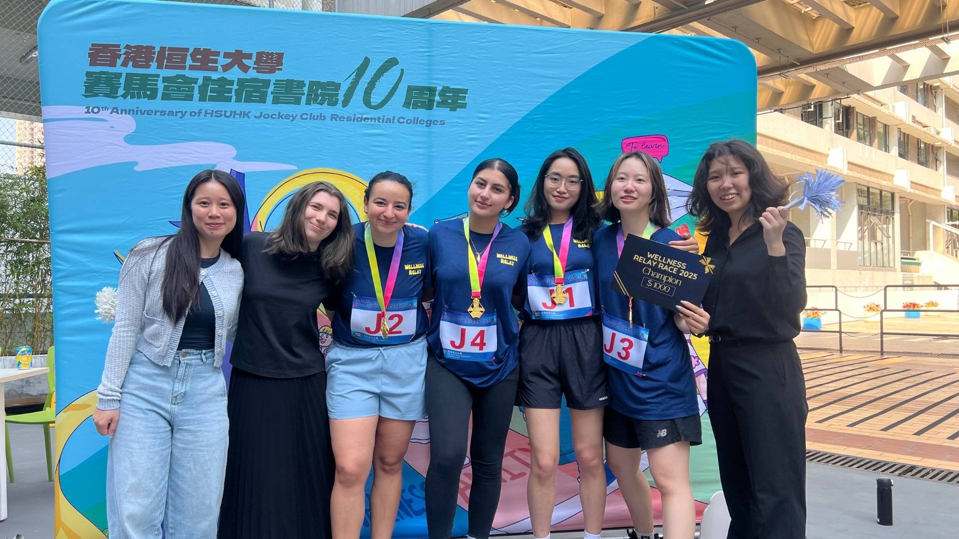 Photograph of the winning relay race team in Hong Kong.
