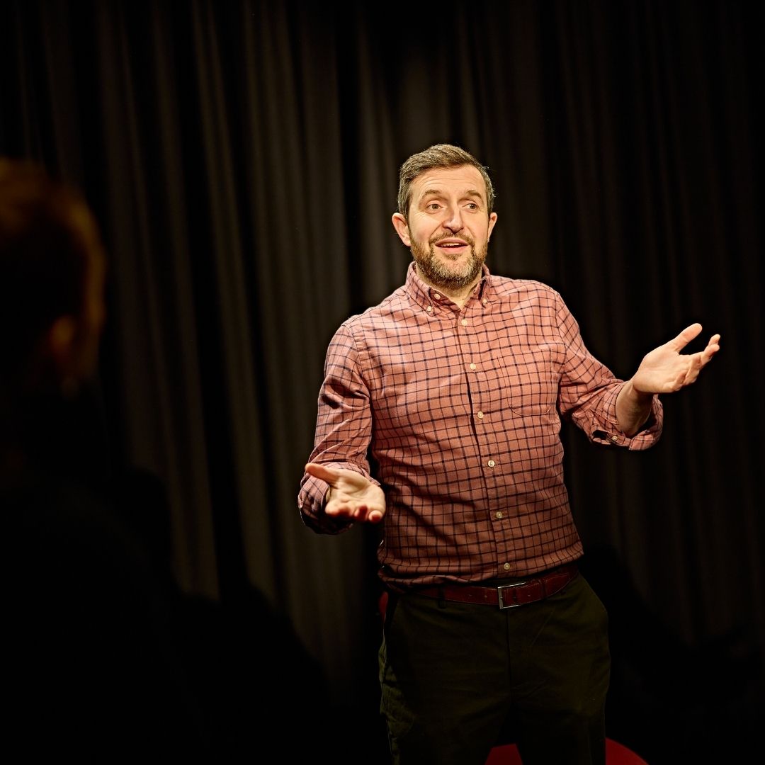 Drama teacher in drama studio delivering a lesson