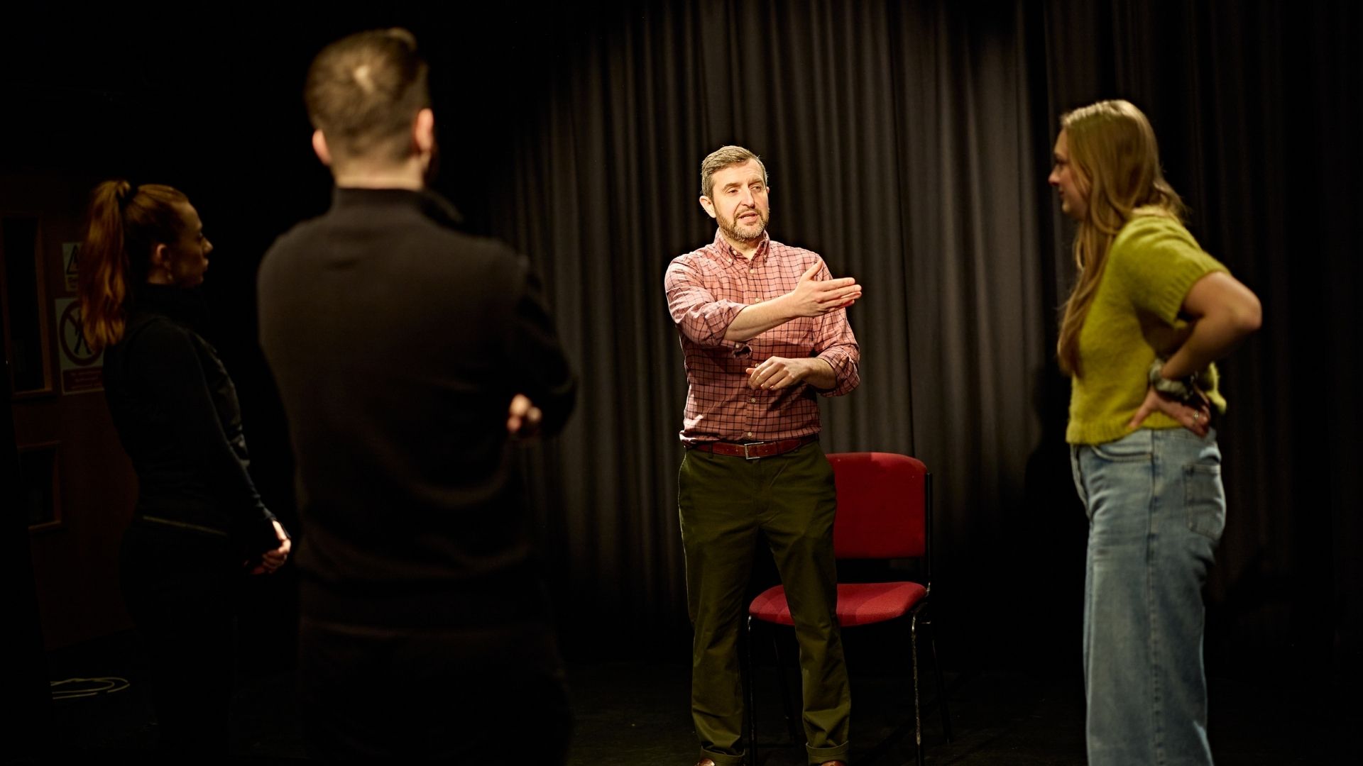 Drama teacher teaching students