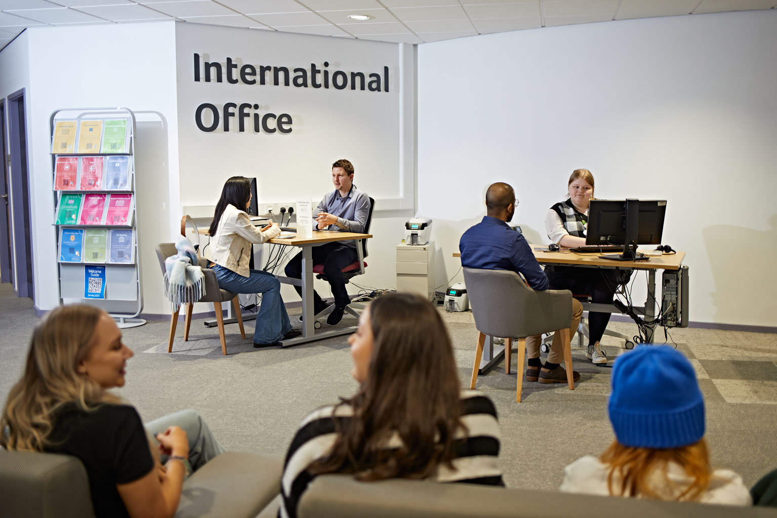 International Office staff speaking to students