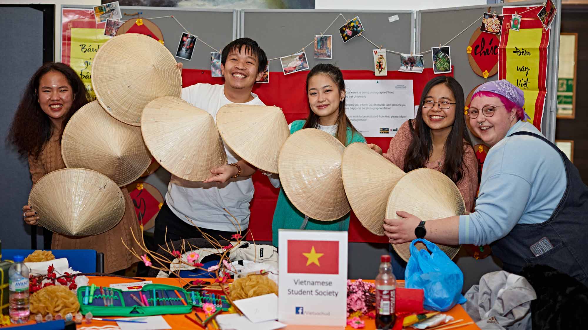 Members of the Vietnamese Society and their friends together on the society stand 