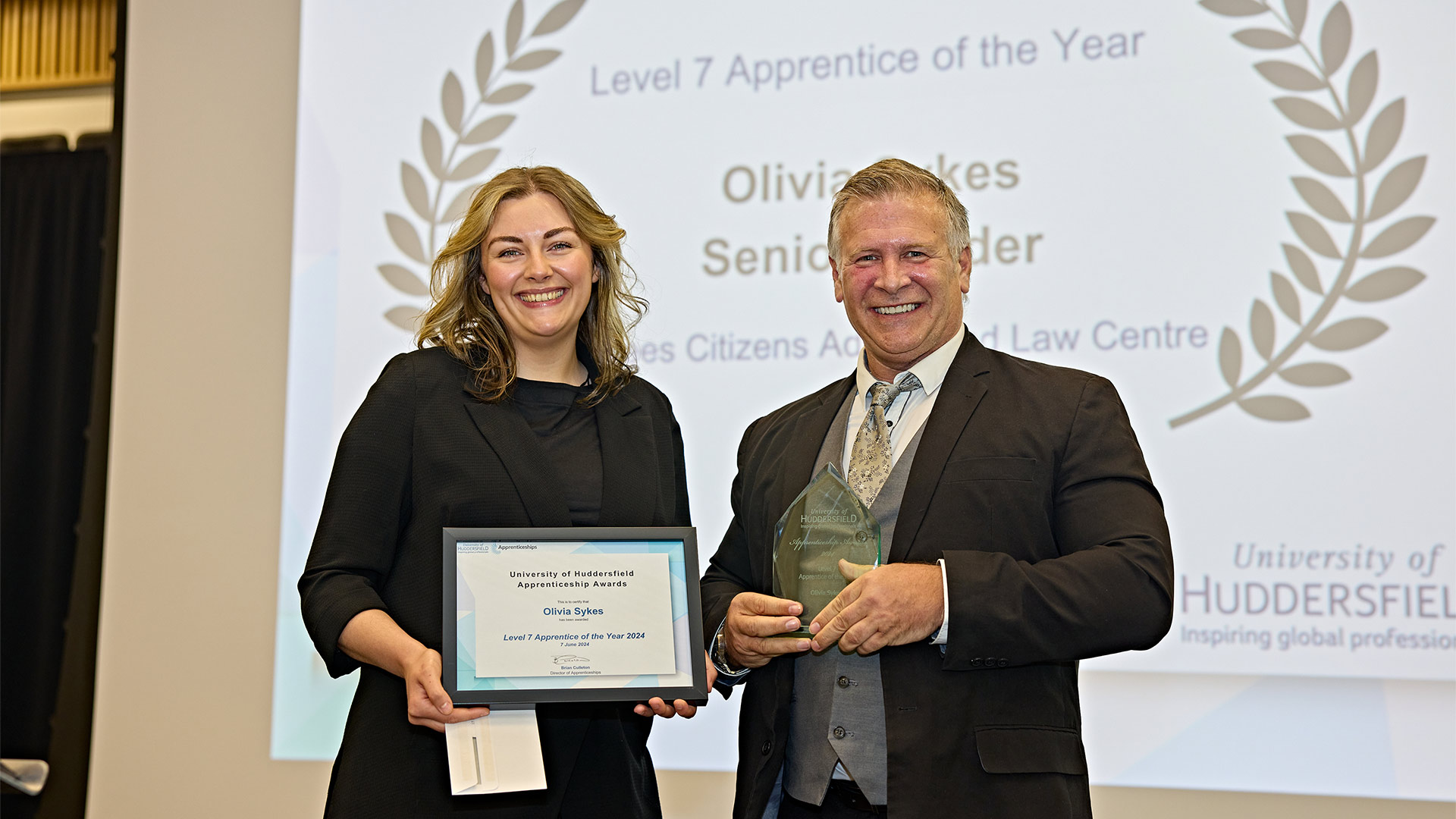 An award being presented on stage