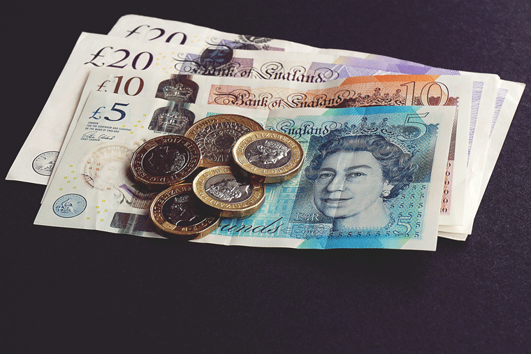 A photo of coins and banknotes