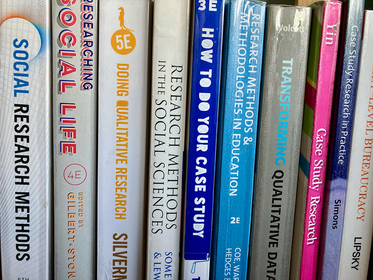 A closeup shot of a row of books stood up.